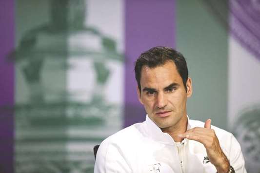 Switzerlandu2019s Roger Federer addresses a press conference.