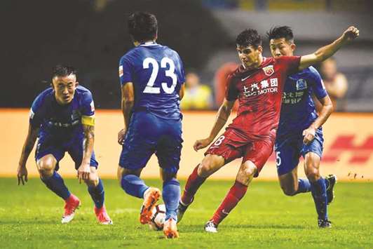 Brazilian midfielder Oscar (second right) made a u00a360mn switch to Shanghai SIPG from Chelsea in January this year.