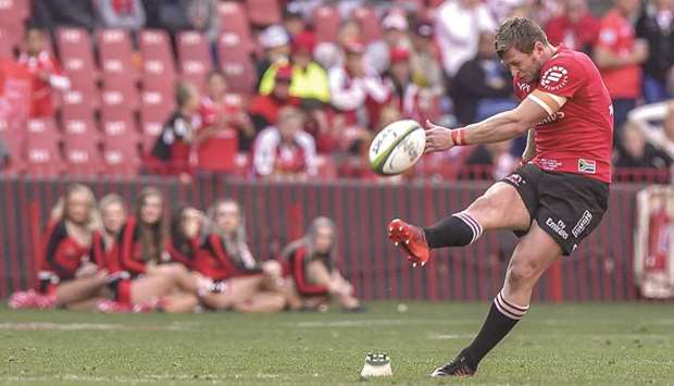 Golden Lionsu2019 Ruan Combrink delivers the winning long-range penalty kick during the Super Rugby quarter-final against Coastal Sharks at the Ellis Park rugby Stadium in Johannesburg yesterday. (AFP)