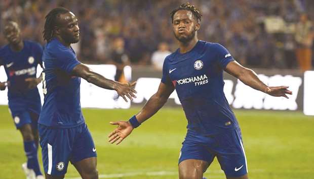 Chelseau2019s Michy Batshuayi (R) celebrates after scoring against Arsenal during their pre-season friendly at Beijingu2019s National Stadium, known as the Birdu2019s Nest yesterday.