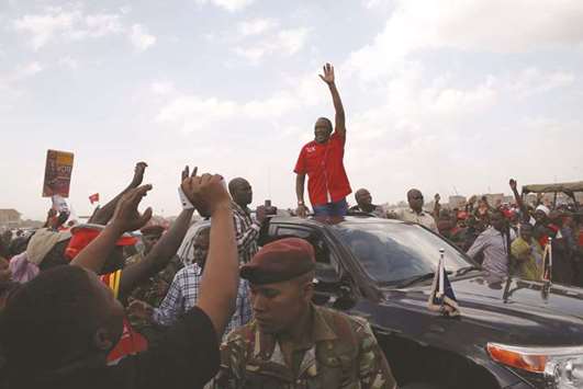 Kenyau2019s President Uhuru Kenyatta waves as he leaves a Jubilee Party election rally in Nairobi.
