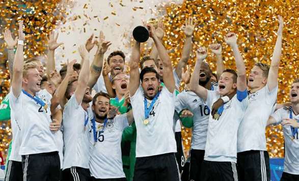 Germany players celebrate with the trophy after winning the FIFA Confederations Cup by beating Chile 1-0 in the final in Saint Petersburg, Russia, yesterday. (Reuters)