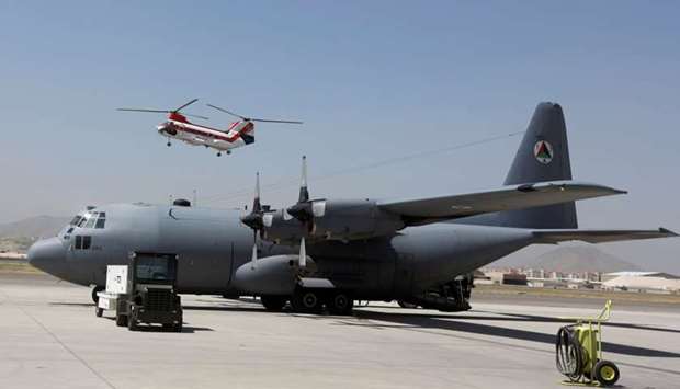 An Afghan Air Force C-130 military transport plane is parked before a flight in Kabul, Afghanistan July 9, 2017