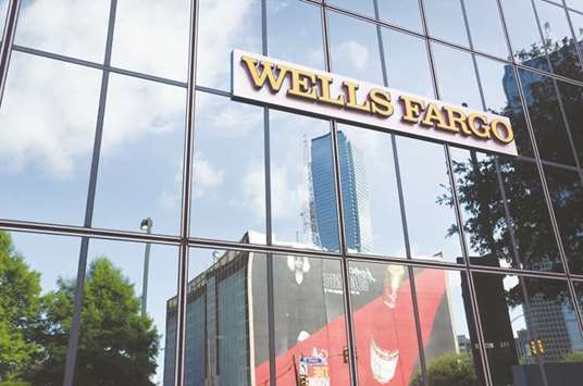 Wells Fargo & Co signage is displayed on the exterior of a bank branch in Dallas. The banku2019s latest troubles come just 10 months after regulators disclosed that Wells Fargo employees had been opening potentially millions of accounts in its retail banking division without customersu2019 permission over a half decade.