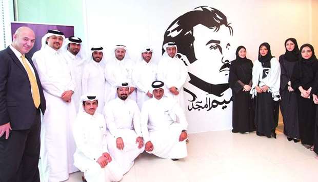 Astad CEO Ali al-Khalifa and Astad employees express solidarity and support during a signing ceremony held recently