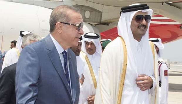 His Highness the Emir Sheikh Tamim bin Hamad al-Thani welcomes Turkish President Recep Tayyip Erdogan at Hamad International Airport on Monday.