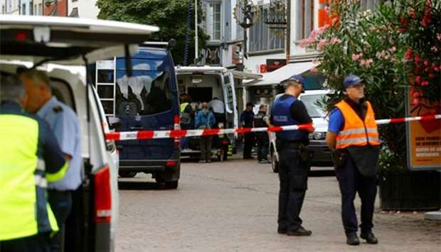 Swiss police officers are seen at a crime scene in Schaffhausen, Switzerland on Monday.