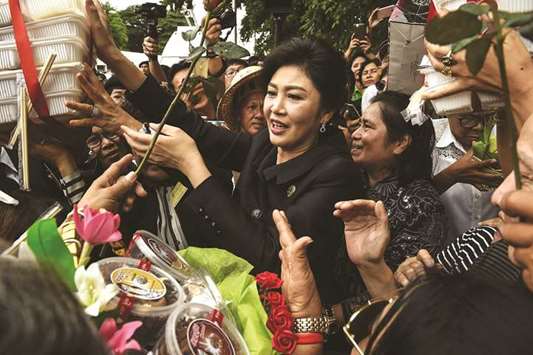 Former Thai prime minister Yingluck Shinawatra speaks to supporters outside the Supreme Court in Bangkok last week.