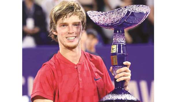 Russiau2019s Andrey Rublev poses with his trophy after winning the ATP Croatia Open tennis tournament in the coastal city of Umag on Sunday. (AFP)