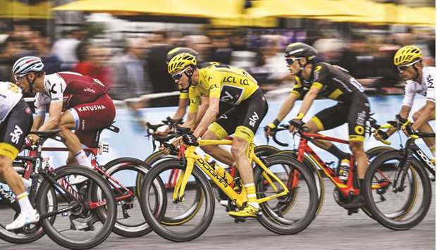 Great Britainu2019s Christopher Froome (centre) now stands just one short of the record five Tour de France cycling titles achieved by Belgian Eddy Merckx, Spain's Miguel Indurain and French duo Jacques Anquetil and Bernard Hinault. (AFP)