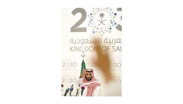 Saudi Crown Prince Mohammed bin Salman gestures at a press conference in Riyadh on April 25, 2016. More than a year after Prince Mohammed unveiled a blueprint for the post-oil era, the drop in crude prices is making economists more sceptical about whether some of the planu2019s medium-term targets can be met.