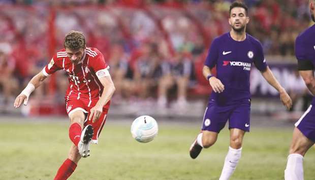 Bayern Munichu2019s Thomas Muller scores the third goal during the pre-season friendly game against Chelsea in Singapore. (Reuters)