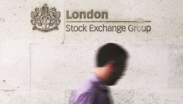 A visitor passes a sign as he enters the London Stock Exchange Groupu2019s offices in Paternoster Square. Londonu2019s FTSE 100 closed 0.8% up at 7,434.82 points yesterday.