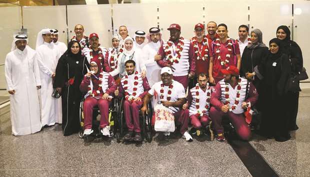 Secretary General of the Qatar Olympic Committee (QOC) Dr Thani bin Abdulrahman al-Kuwari with the Qataru2019s para athletics team after they arrived in Doha from London, where they participated in the 2017 World Para Athletics Championships.