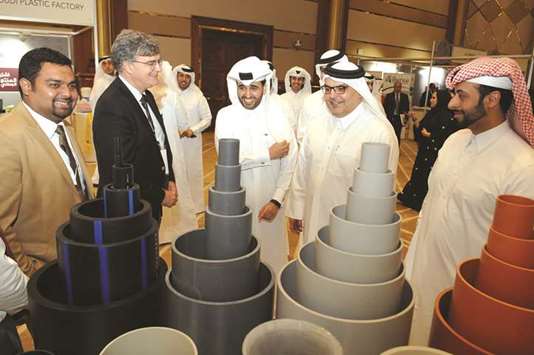 QDB CEO Abdulaziz bin Nasser al-Khalifa is joined by Ashghal president Dr Saad bin Ahmed al-Muhannadi during a tour of the second u2018Buy Local Productsu2019 exhibition yesterday. PICTURE: Nasar T K
