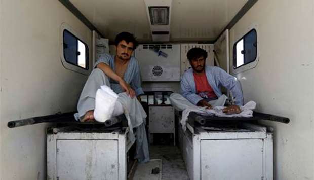 Injured members of the Afghan security forces wait for transport taking them for treatment in Kabul, inside an ambulance at the Kandahar military Airport, earlier this month.