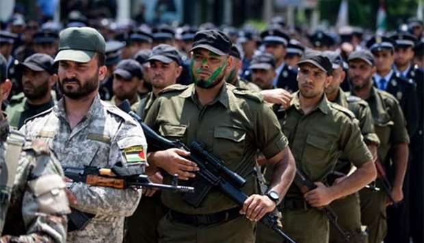 Members of Palestinian forces loyal to Hamas take part in a military parade in Gaza City on Wednesday as a tense standoff is underway between Israel and Muslim worshippers at Jerusalem's Al-Aqsa compound.