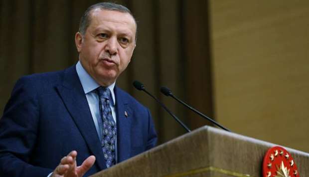 Turkish President Tayyip Erdogan addresses academics during a meeting at the Presidential Palace in Ankara, Turkey