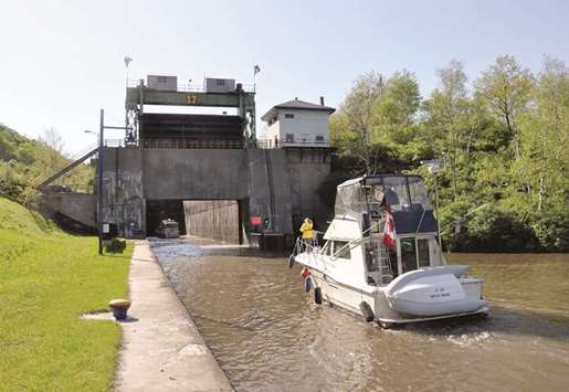 A boat heads toward Lock 17. Locks are elevators for boats, lifting and lowering them as they travel along the waterway. Today, there are 57 locks on New Yorku2019s canal system.