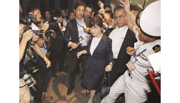 Japanu2019s Defence Minister Tomomi Inada is surrounded by the media as she leaves the Defence Ministry in Tokyo.
