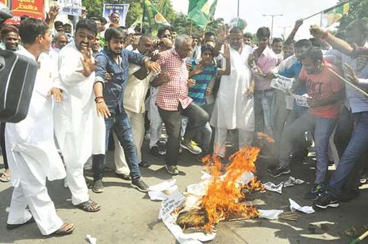 RJD workers stage a demonstration against Bihar Chief Minister Nitish Kumar in Patna yesterday.