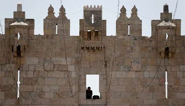 Israeli police stand guard at the Damascus Gate to Jerusalem's Old City on Friday.