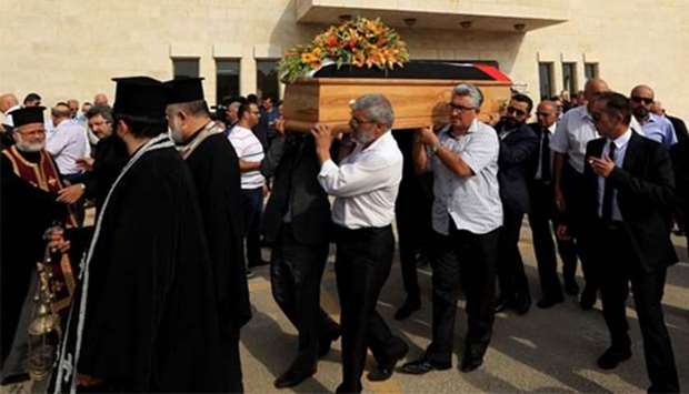 Jordanian mourners attend a funeral of Bashar Hamarneh, a doctor who was in the residential quarter of the Israeli embassy at the time of an attack on the weekend, during his funeral in Madaba on Thursday.