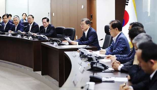 South Korean President Moon Jae-In (C) presides over an emergency meeting with National Security Council members