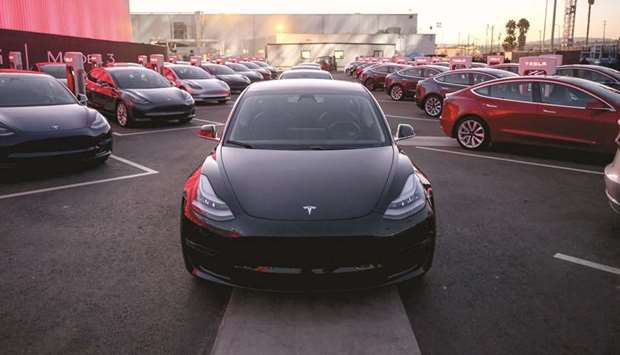 Tesla Model 3 cars are seen as Tesla holds an event at the factory handing over its first 30 Model 3 vehicles to employee buyers at the companyu2019s Fremont facility in California.