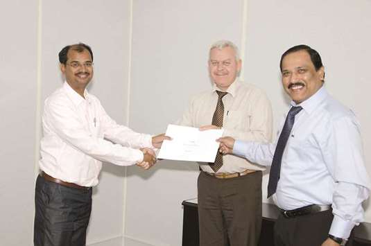 Syed Yawar Ali getting an Appreciation Certificate from his company management.