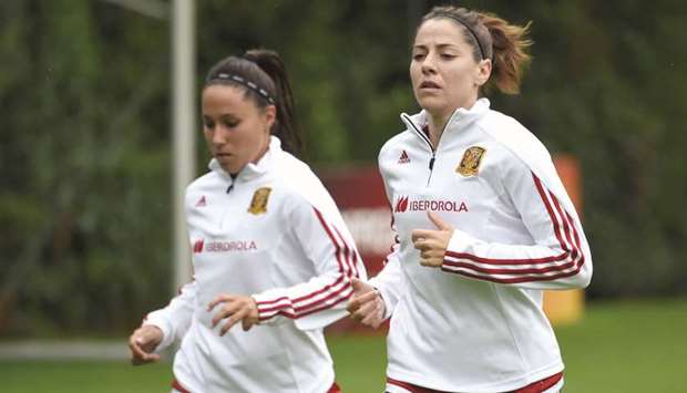 Spainu2019s midfielder Vicky Losada (R) takes part in a training session.