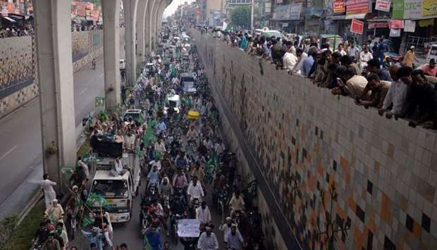 Supporters of ousted Pakistani prime minister Nawaz Sharif march during a rally in Rawalpindi