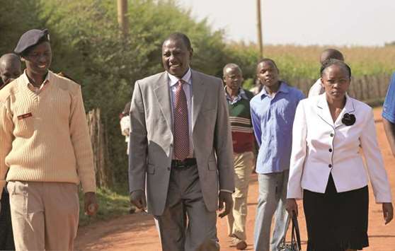 File photo shows Kenyau2019s Deputy President William Ruto and his wife Rachael walk to their home in Sugoi village near Eldoret.