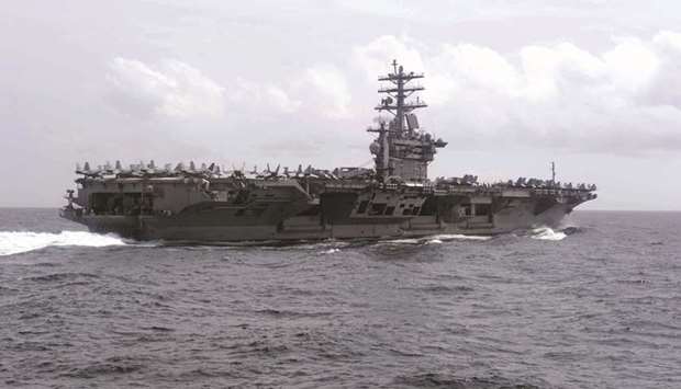This US Navy handout photo obtained yesterday shows the aircraft carrier USS Nimitz  (CVN 68) as it transits the Indian Ocean.