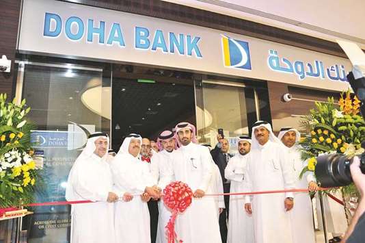 Doha Bank chairman Sheikh Fahad bin Mohamed bin Jabor al-Thani is joined by managing director Sheikh Abdul Rehman bin Mohamed bin Jabor al-Thani, chief executive officer Dr R Seetharaman, and other dignitaries during the ribbon-cutting ceremony for the banku2019s new branch at Mall of Qatar.