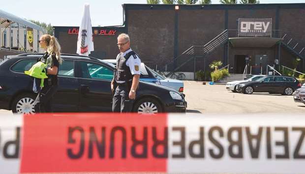 Policemen walk past the Grey nightclub in Konstanz.