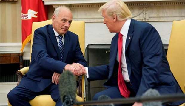 US President Donald Trump shakes hands with John Kelly after he was sworn in as White House Chief of Staff in the Oval Office in Washington on Monday.