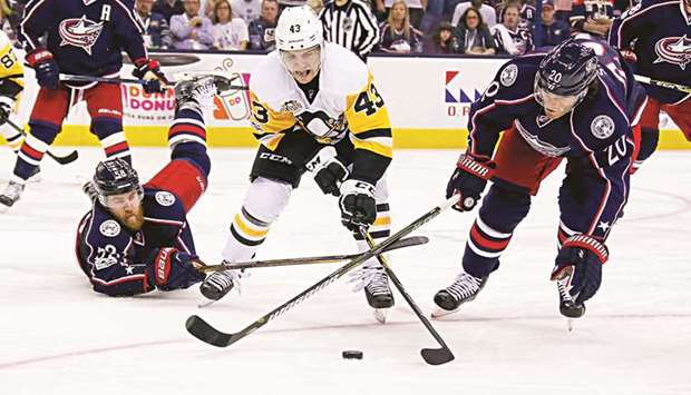 The Pittsburgh Penguins agreed to a three-year contract with forward Conor Sheary (centre) on Sunday to avoid arbitration.