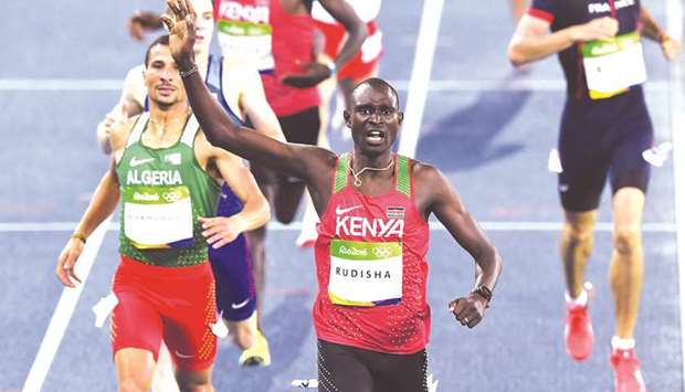 File picture of Kenyau2019s David Lekuta Rudisha (C) celebrating as he crosses the finish line to win the Menu2019s 800m at the Rio Games.