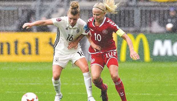 Denmarku2019s captain Pernille Harder (R) in action during the UEFA Womenu2019s Euro 2017 quarter-final against Germany.