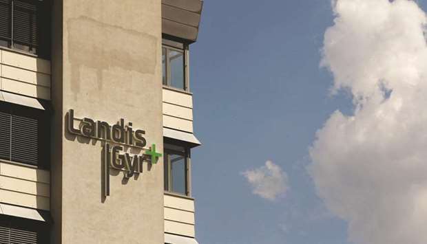 The logo of Swiss-based meter maker Landis+Gyr is seen at an office building in the Swiss town of Zug. The energy metering company is one of several assets Toshiba has put up for sale as it tries to make up for multibillion dollar losses at its Westinghouse nuclear energy unit.