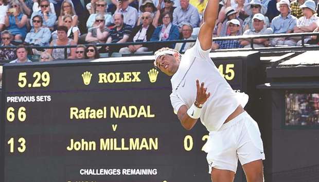 Spainu2019s Rafael Nadal serves against Australiau2019s John Millman during their menu2019s singles first round match on the first day of Wimbledon yesterday.