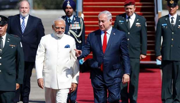 Israeli Prime Minister Benjamin Netanyahu (C-L) greets his Indian counterpart Narendra Modi (C-R) during an official ceremoney at Ben-Gurion International airport near Tel Aviv.