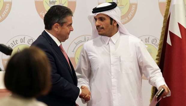 HE the Foreign Minister Sheikh Mohammed bin Abdulrahman al-Thani shakes hands with German Foreign Minister Sigmar Gabriel following a joint news conference in Doha.