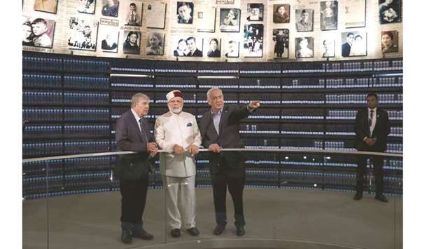 Prime Minister Narendra Modi accompanied by Israeli Prime Minister Benjamin Netanyahu (right) visits the u201cHall of Namesu201d in the Yad Vashem Holocaust memorial museum in Jerusalem yesterday.