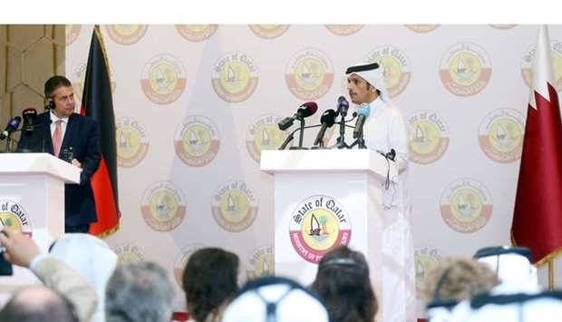 Gabriel and Shiekh Mohamed addressing a joint news conference in Doha