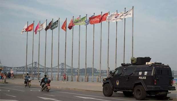 An armoured police van is seen next to the Friendship bridge on the Yalu River connecting the North Korean town of Sinuiju and Dandong in Chinese border city of Dandong on Wednesday.