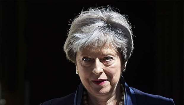 Britain's Prime Minister Theresa May leaves No 10 Downing Street for Prime Minister's Question Time at Westminster, in London on Wednesday.