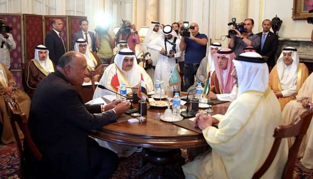 Saudi Foreign Minister Adel al-Jubeir (2-R), UAE Foreign Minister Abdullah bin Zayed al-Nahyan (R), Egyptian Foreign Minister Sameh Shoukry (L), and Bahraini Foreign Minister Khalid bin Ahmed al-Khalifa (2-L) meet to discuss the diplomatic situation with Qatar, in Cairo, Egypt.