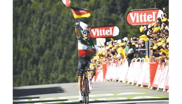 Italyu2019s Fabio Aru celebrates as he crosses the finish line at the end of the 160.5 km fifth stage of the 104th edition of the Tour de France cycling race yesterday.